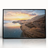 Large abstract wall art depicting a European scenery in muted earth tones, framed in black acrylic.