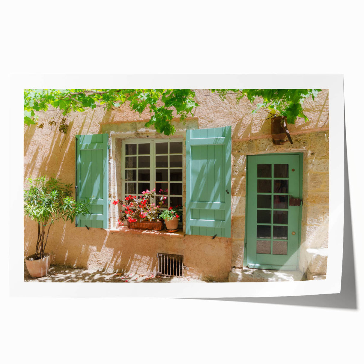Rolled print of a serene French southern landscape with soft floral elements, in muted green and blue tones.