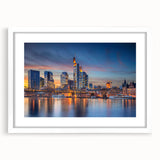 Textured abstract art print of a European scenery in muted earth tones, framed in white, suitable for bedroom decor.