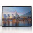 Large abstract wall art depicting a European cityscape in muted gray tones, framed in black acrylic.