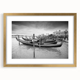 Abstract art print of Venice scenery in muted gold and blue tones on a framed canvas, suitable for dining room decor.