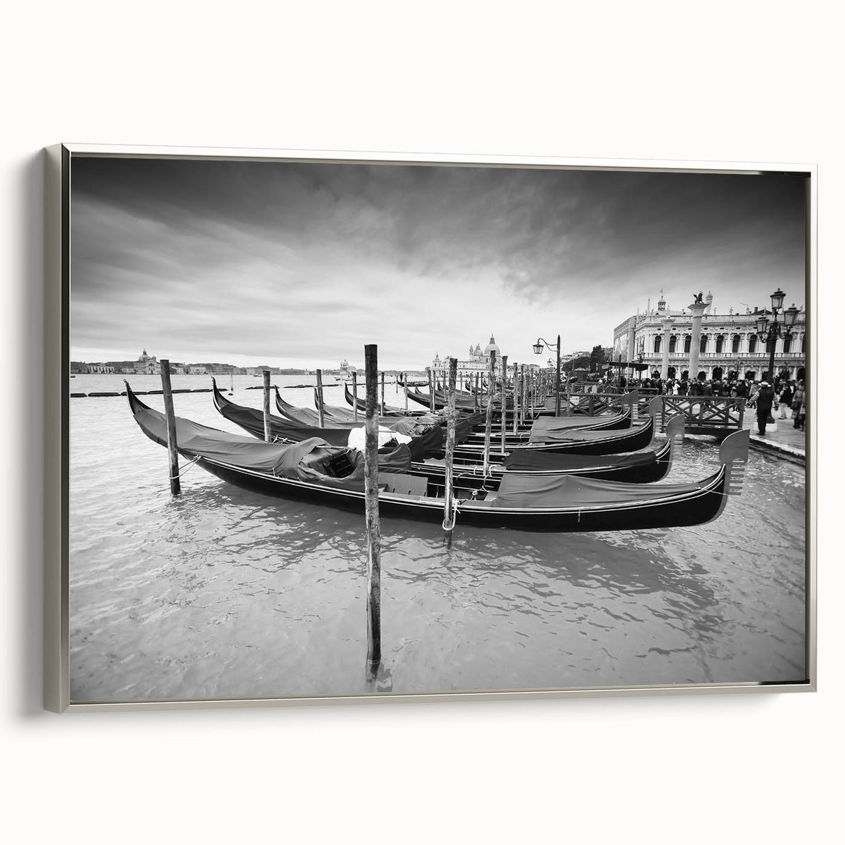 Framed canvas featuring a vintage-style landscape painting of Venice with colorful buildings and black gondolas on muted…