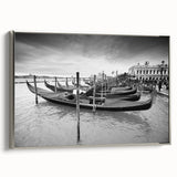 Framed canvas featuring a vintage-style landscape painting of Venice with colorful buildings and black gondolas on muted…