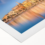 Art deco poster depicting the Monaco coastline in muted blue and tan hues on a rolled canvas, suitable for dining room decor.