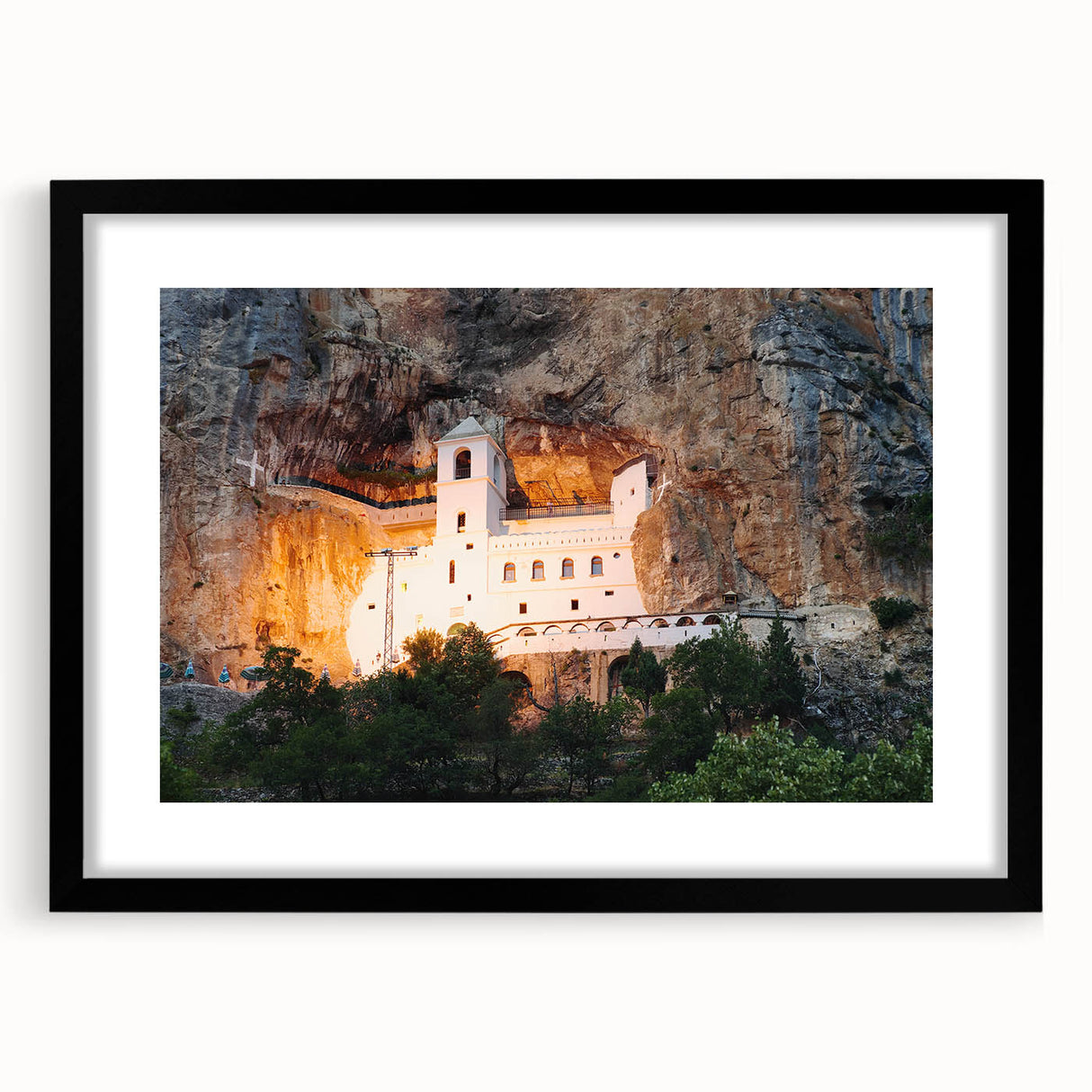 Abstract art print of a European scenery in vibrant colors, textured on a large black-framed canvas.