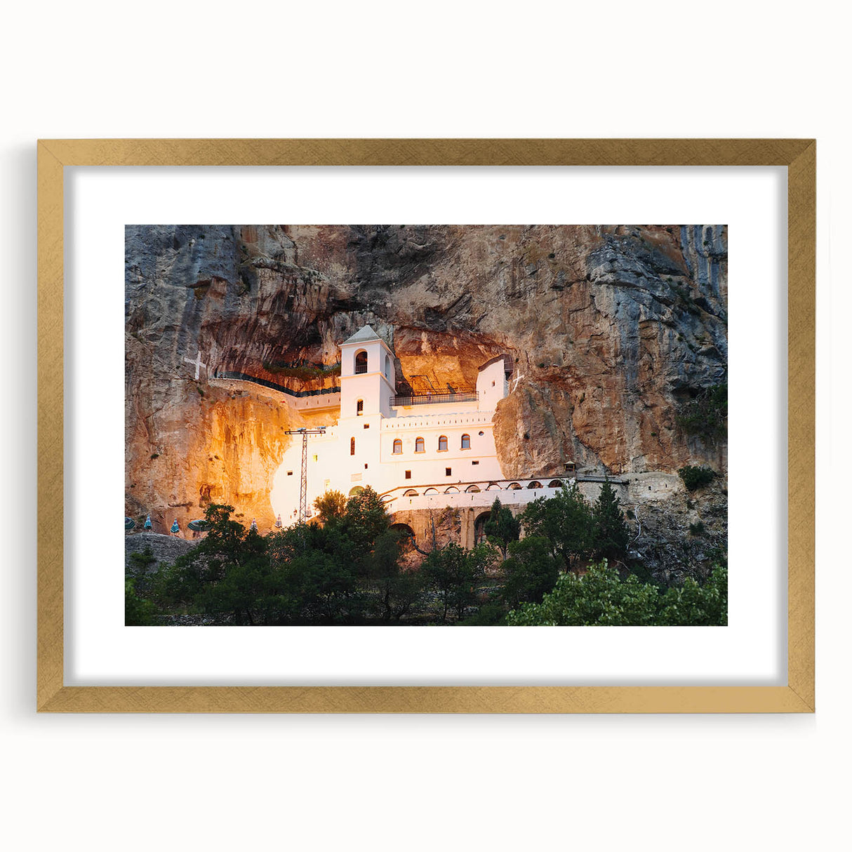Abstract art print of a Montenegro scenery in muted earth tones on a framed gold mat, suitable for dining room decor.