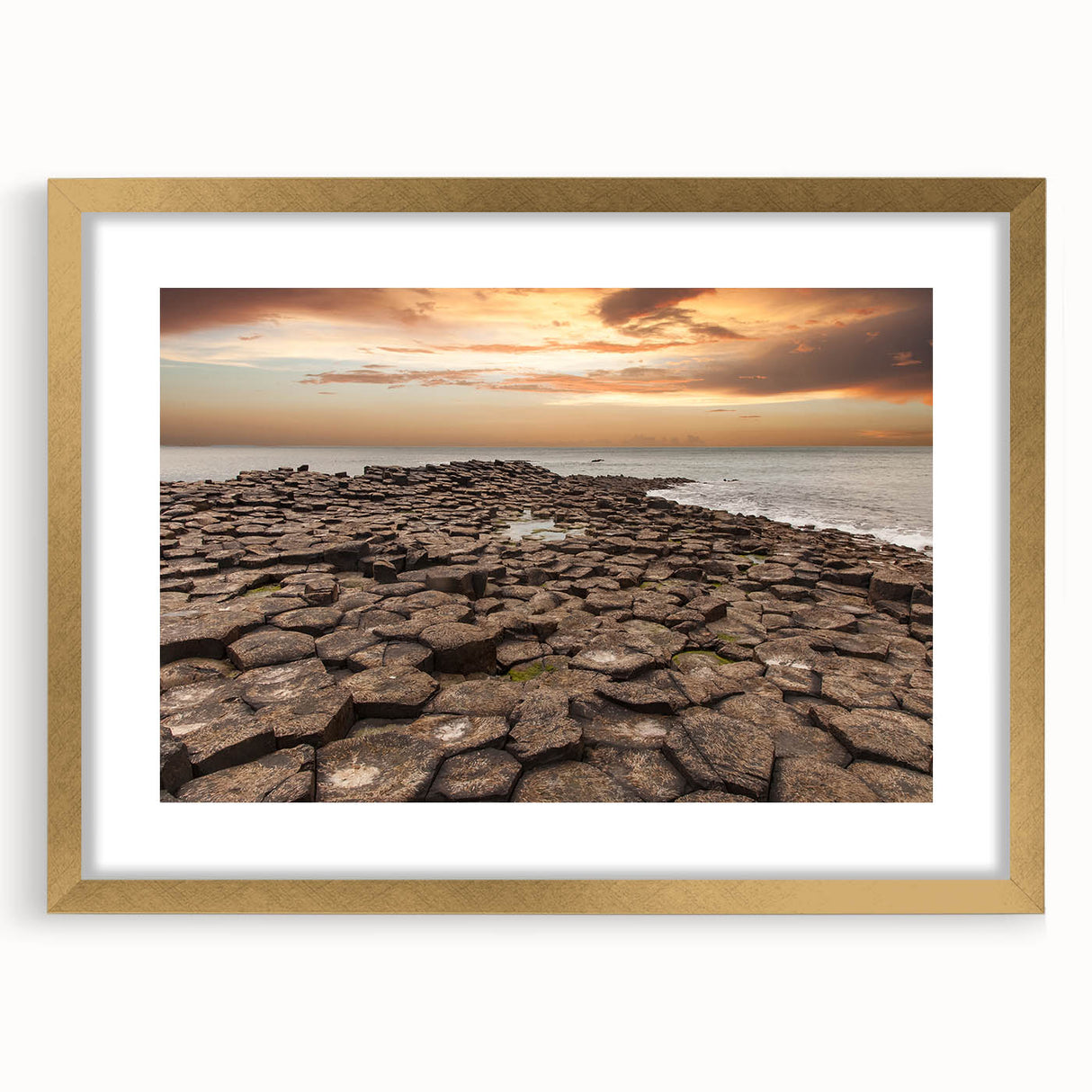 Abstract art print of Northern Ireland scenery in gold frame, ideal for dining room decor.
