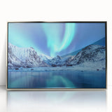 Large art print of a serene Norwegian landscape in muted green and blue tones, framed in silver acrylic.