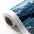 Art Deco poster of a serene Scottish landscape on rolled canvas, using soft green and blue tones, ideal for nursery wall art.