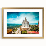 Abstract art print of Barcelona scenery in muted gold and blue tones on a framed canvas, suitable for dining room decor.