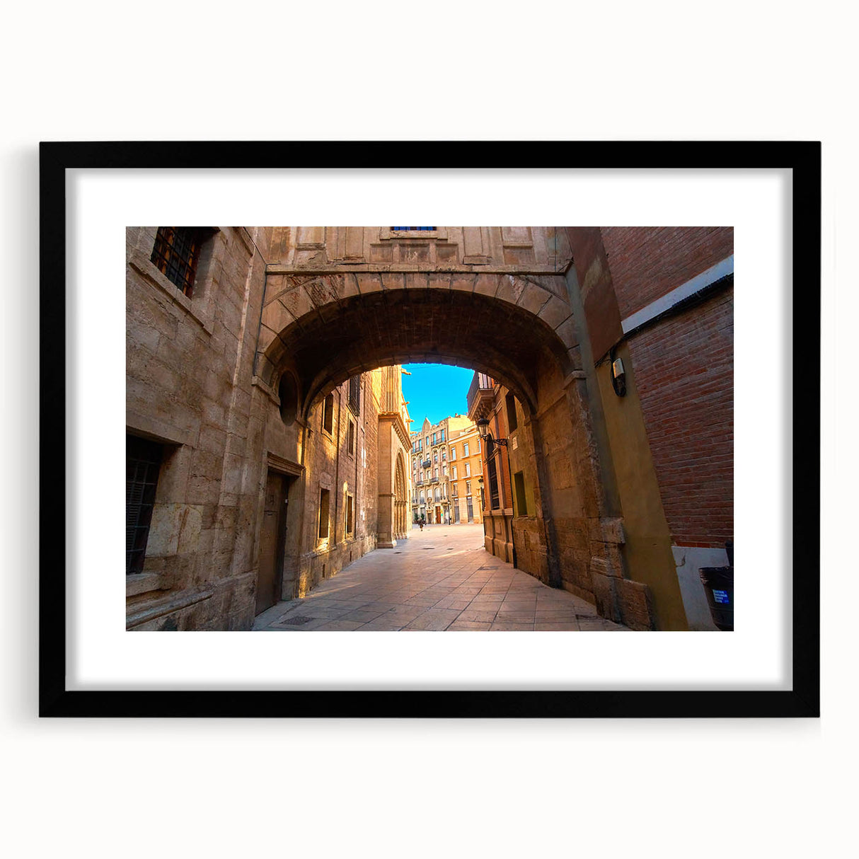 Extra large abstract art print of vibrant, colorful Spanish scenery on textured canvas, framed in black.