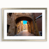Textured abstract art print depicting a European scenery in muted earth tones, framed in silver, ideal for bedroom art.