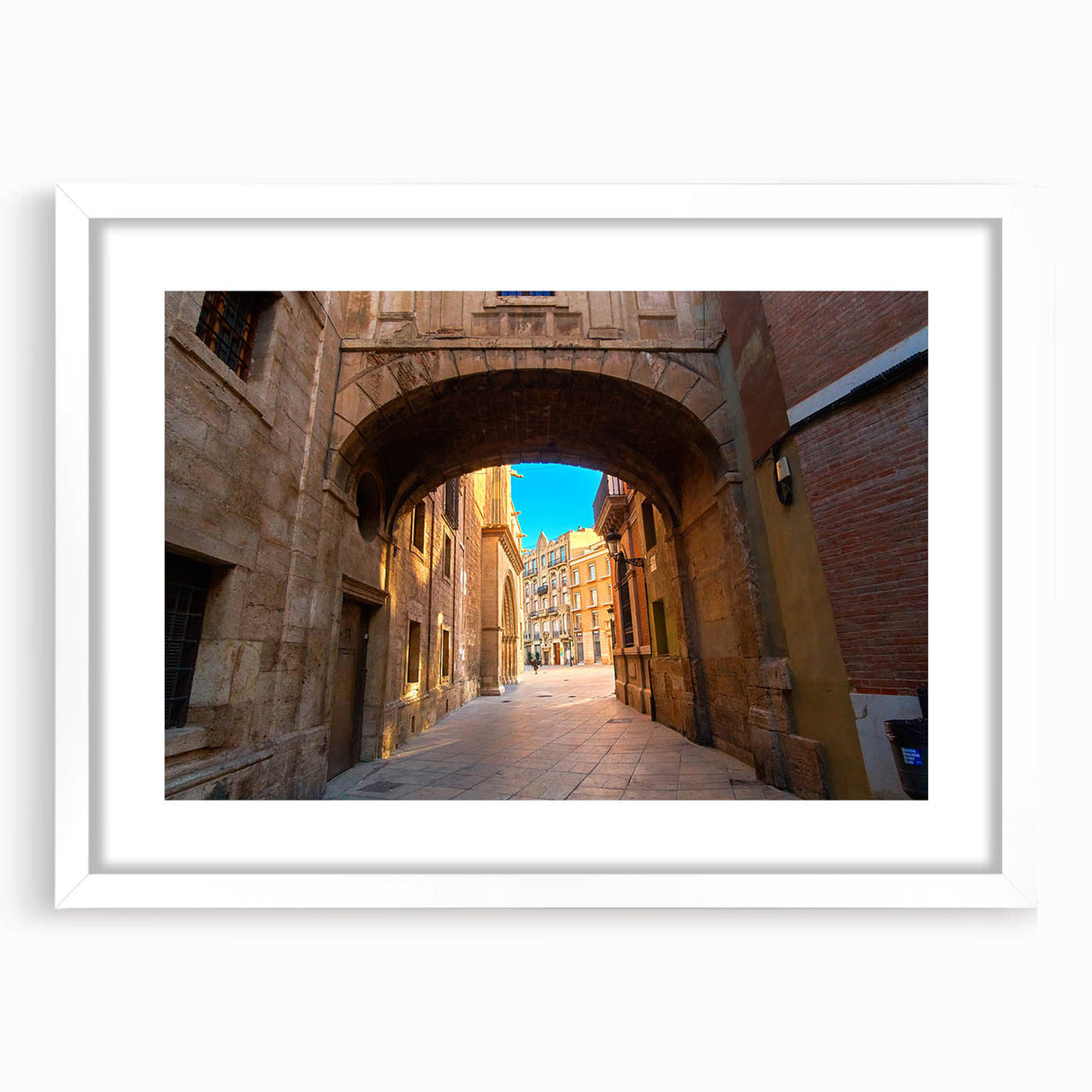 Abstract art print of Valencia scenery in muted earth tones on a framed white mat, suitable for dining room decor.