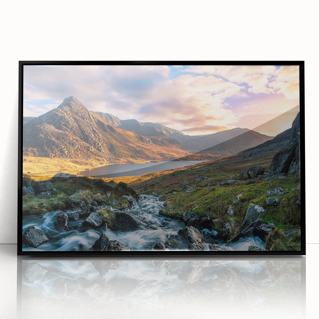Large abstract wall art depicting a stylized Welsh landscape in muted earth tones, framed in black acrylic.