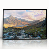 Large abstract wall art depicting a stylized Welsh landscape in muted earth tones, framed in black acrylic.