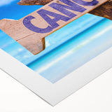 Art deco poster of Cancun scenery on rolled canvas, displaying vibrant ocean and sky colors, ideal for dining room wall art.