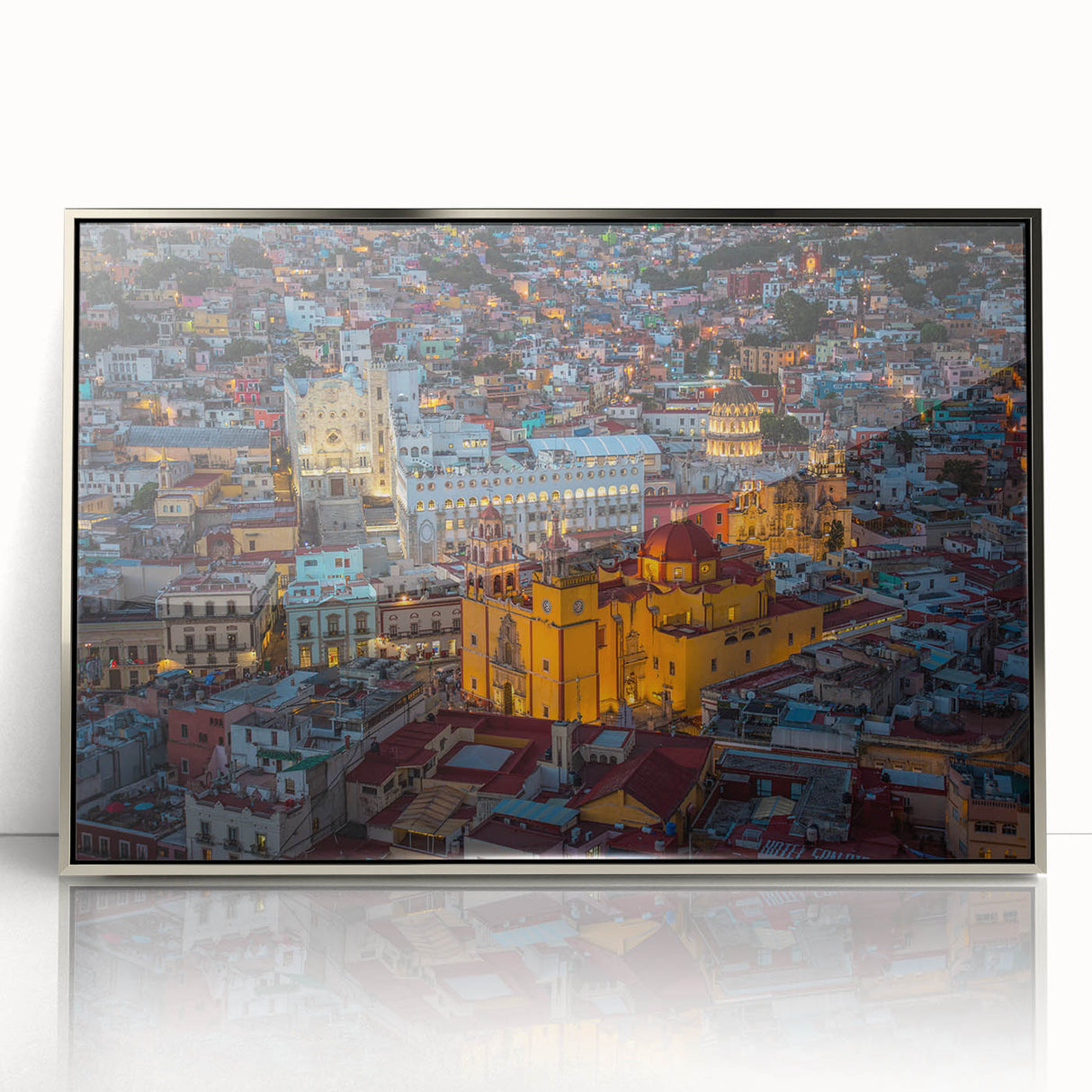 Mid-century modernist art depicting Guanajuato, Mexico scenery in vibrant colors on a silver-framed acrylic print.
