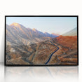 Large abstract wall art depicting a Middle Eastern scenery in muted earth tones on a framed acrylic.