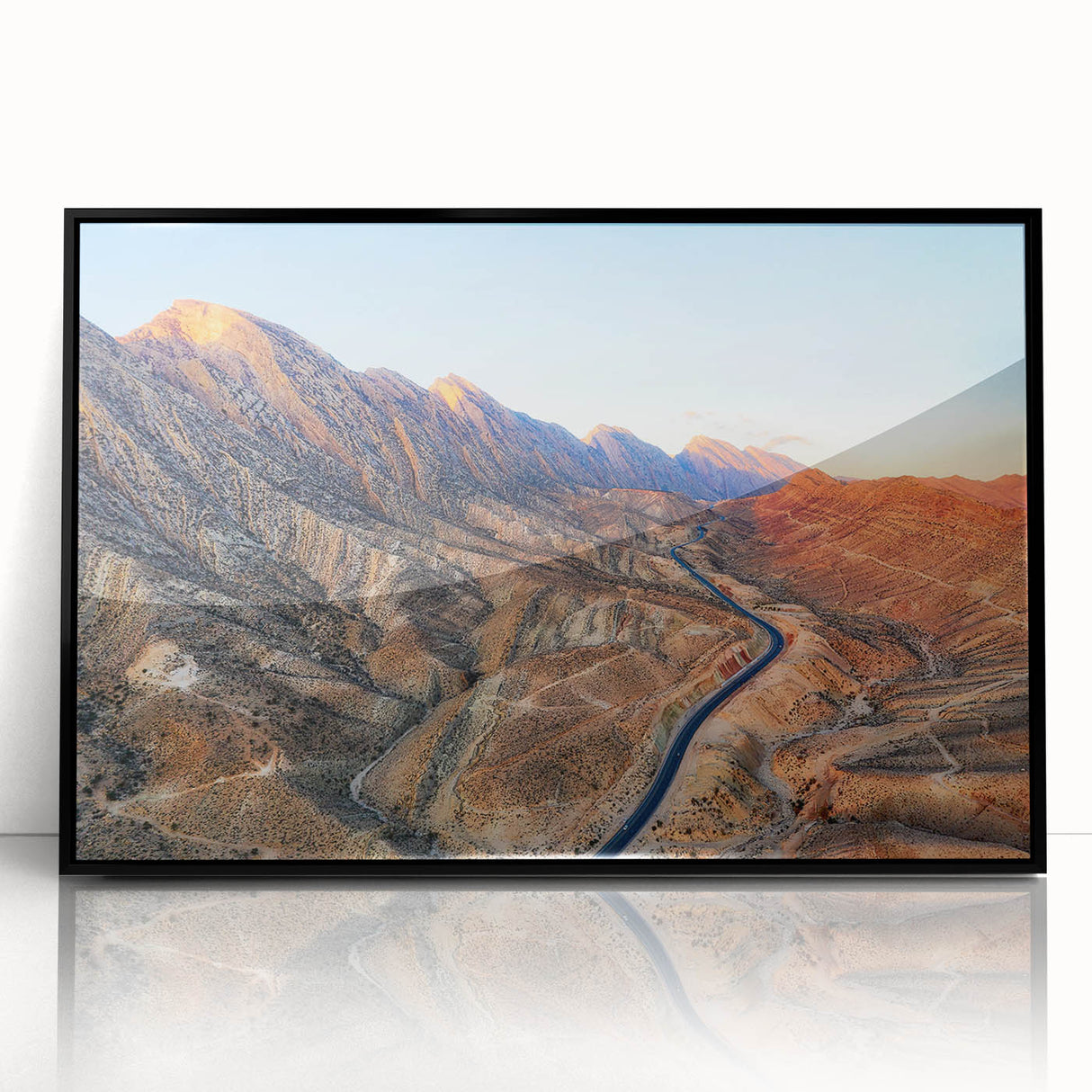 Large abstract wall art depicting a Middle Eastern scenery in muted earth tones on a framed acrylic.