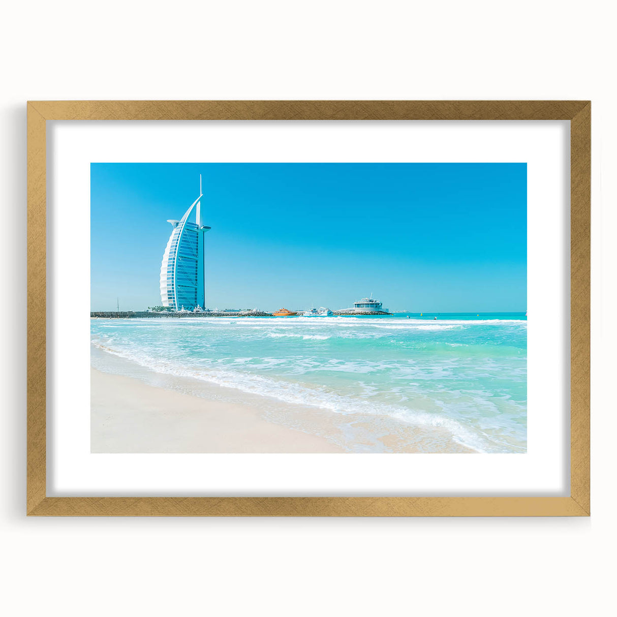 Extra large textured abstract art print of Burj Al Arab in muted gold and blue tones, framed with a gold mat.