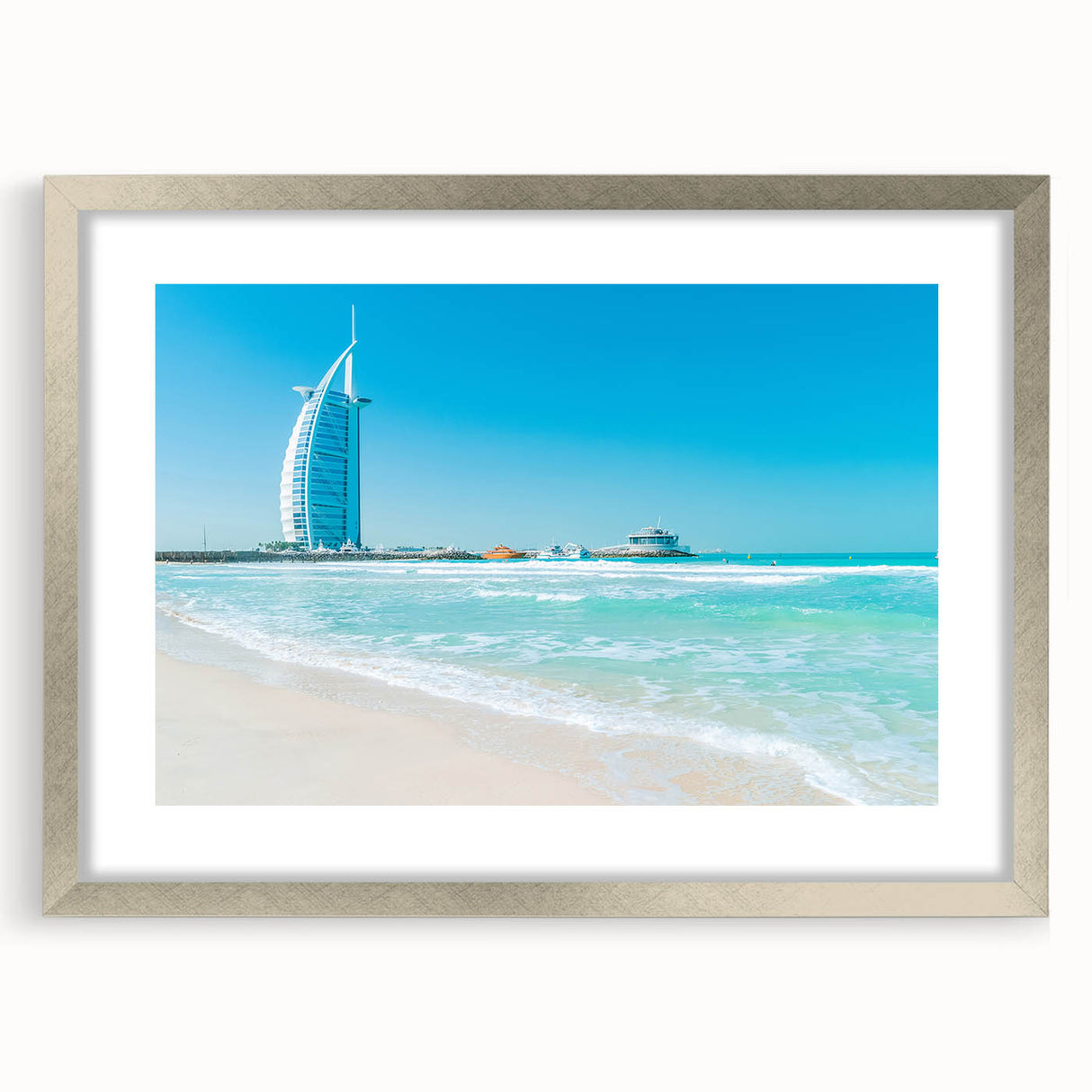 Textured abstract art print featuring a muted gray and blue depiction of the Burj Al Arab, framed in silver.