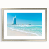 Textured abstract art print featuring a muted gray and blue depiction of the Burj Al Arab, framed in silver.