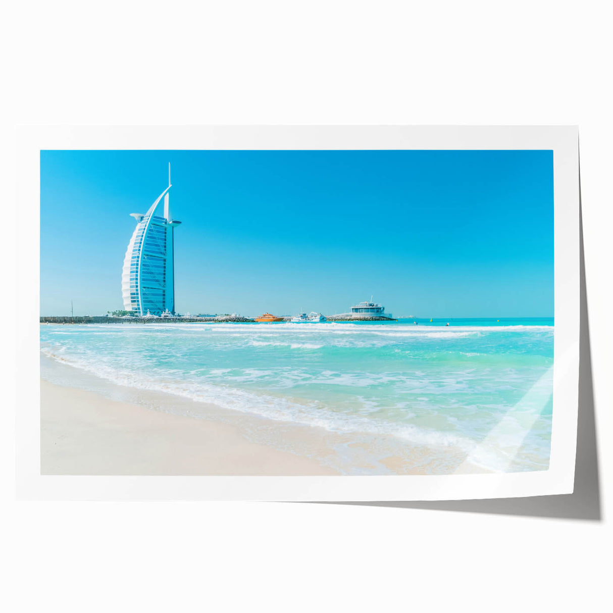 Extra large rolled print of Burj Al Arab with muted blue and sandy tones, ideal for dining room wall art.