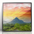 Large abstract wall art of Bora Bora scenery in a black framed acrylic, featuring cool blue and green tones.