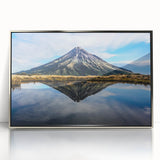 Large abstract wall art depicting Taranaki, New Zealand in vibrant blue and green hues on a silver-framed acrylic print.