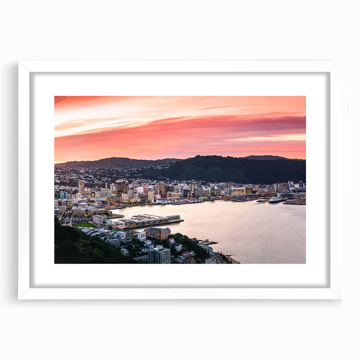 Abstract art print of Wellington, New Zealand in muted blue and green tones on a white framed canvas.