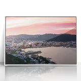 Art deco poster of Wellington, New Zealand skyline in muted gray and blue tones on framed acrylic.