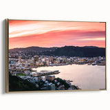 Framed canvas featuring a vintage-style landscape painting of Wellington, New Zealand, with muted gold and black tones.