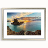 Textured art print depicting an abstract oceanic scene in muted blue and gray tones on a silver-framed canvas.