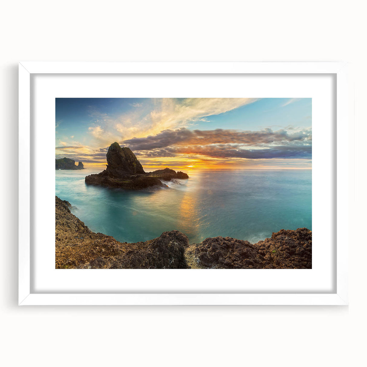Abstract art print of the New Zealand west coast in muted blue and green tones on a white-framed canvas.