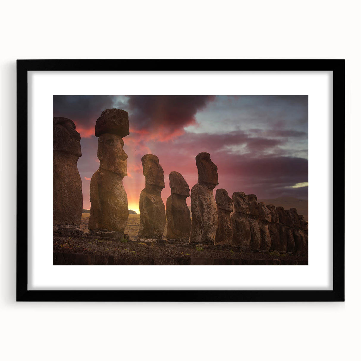 Colorful abstract art print of Easter Island scenery in vibrant hues on a large framed canvas.