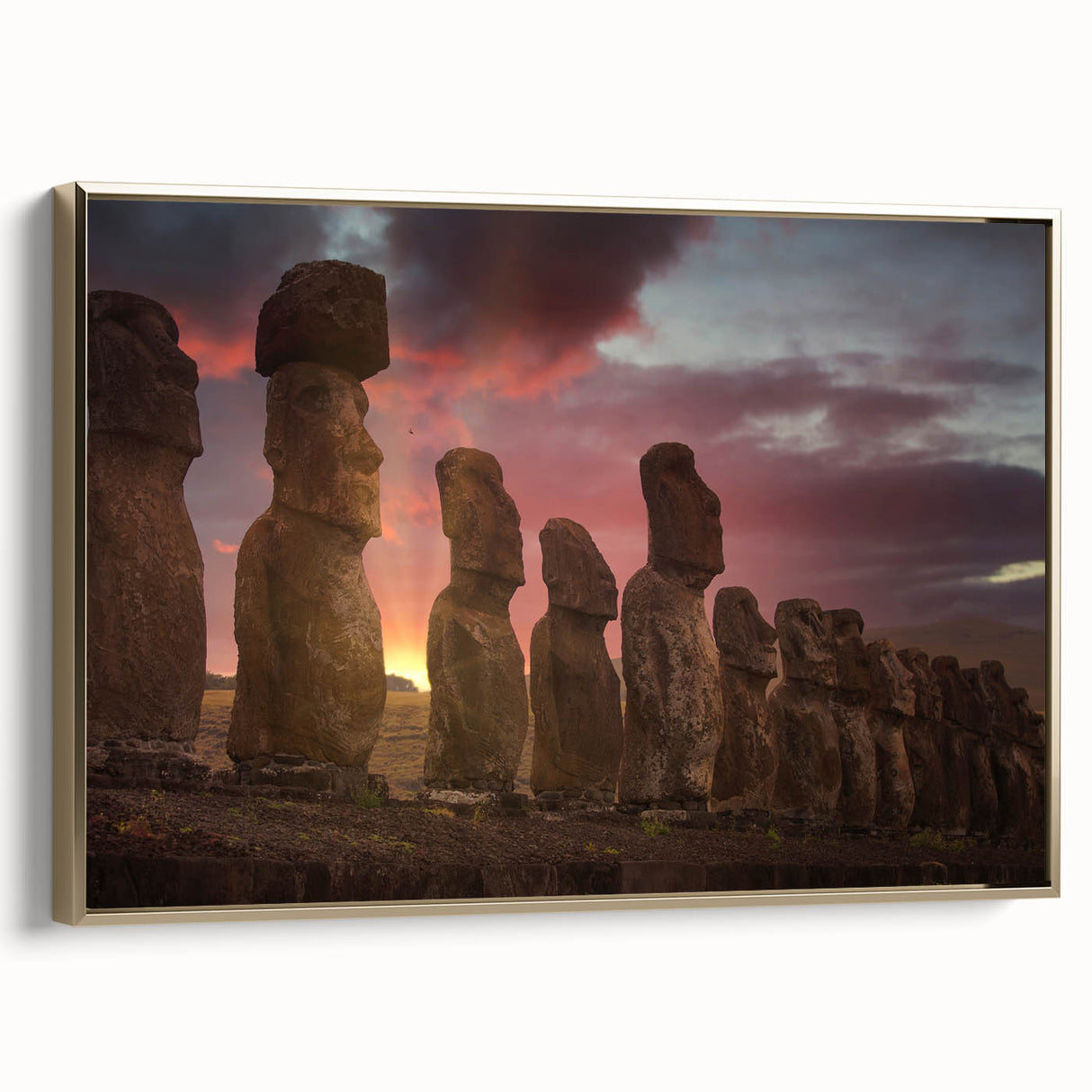 Framed canvas wall art featuring a vintage-style landscape painting of Easter Island with muted earth tones.