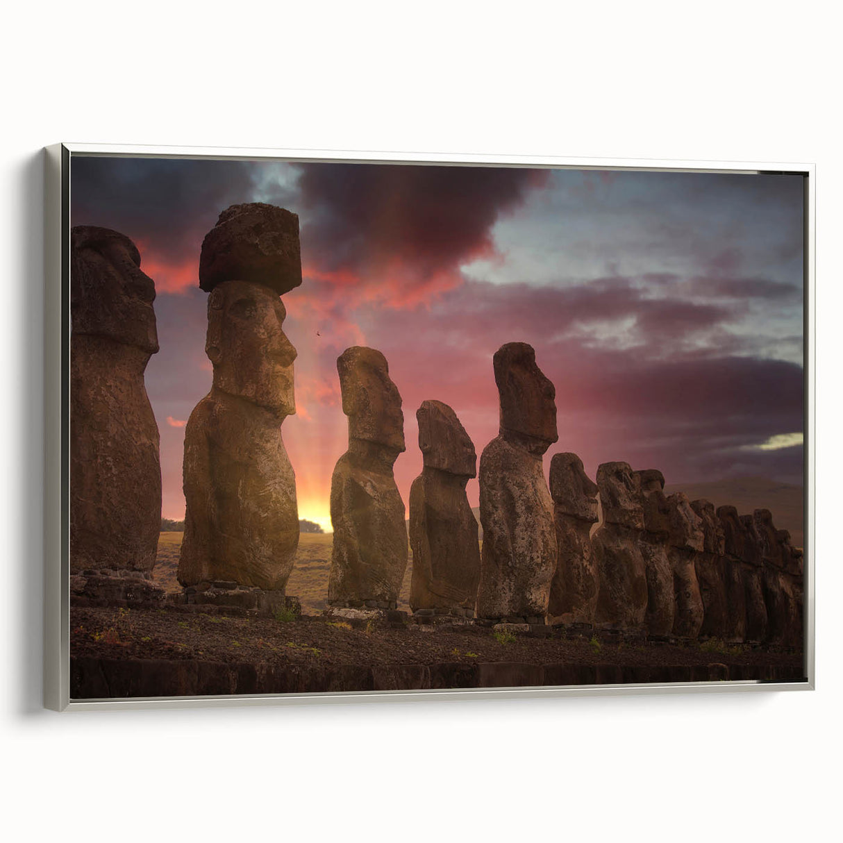 Framed canvas landscape art depicting Easter Island statues in muted earth tones, ideal for living room decor.
