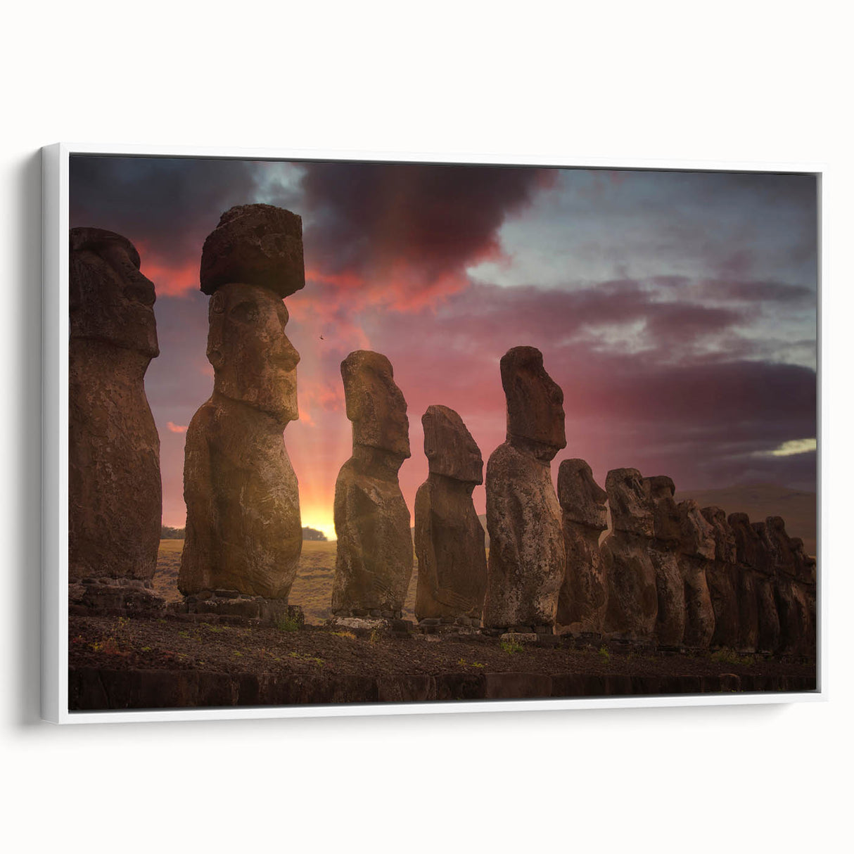 Vintage poster art of Easter Island statues on framed canvas, featuring muted earth tones, ideal for living room decor.
