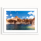 Abstract art print of Lake Powell in muted blue and peach tones, framed with a white mat, ideal for dining room decor.