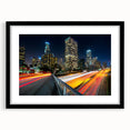 Abstract art print of Los Angeles skyline in vibrant, colorful hues on a large textured canvas, ideal for living room decor.