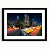 Abstract art print of Los Angeles skyline in vibrant, colorful hues on a large textured canvas, ideal for living room decor.