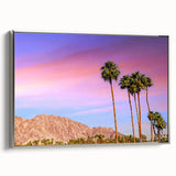 Landscape art painting of Palm Springs with colorful vintage poster art style on a black background, framed in silver canvas.