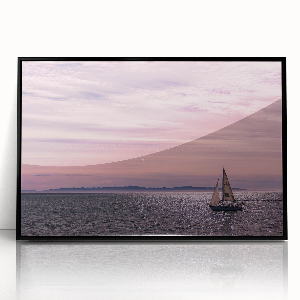 Large abstract wall art depicting the Santa Barbara coastline in muted blue and gray tones on a framed acrylic print.