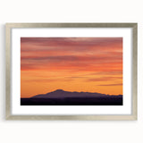 Textured art depicting Pikes Peak in abstract style, with muted earth tones on a framed silver mat, ideal for bedroom art.