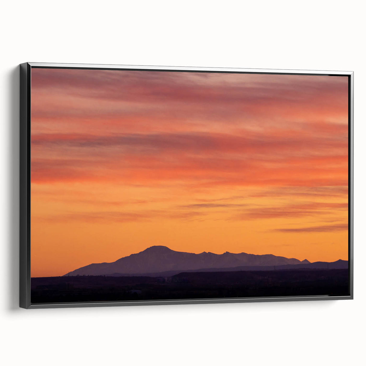 Black and white framed canvas of Pikes Peak landscape, ideal for bedroom wall decor.