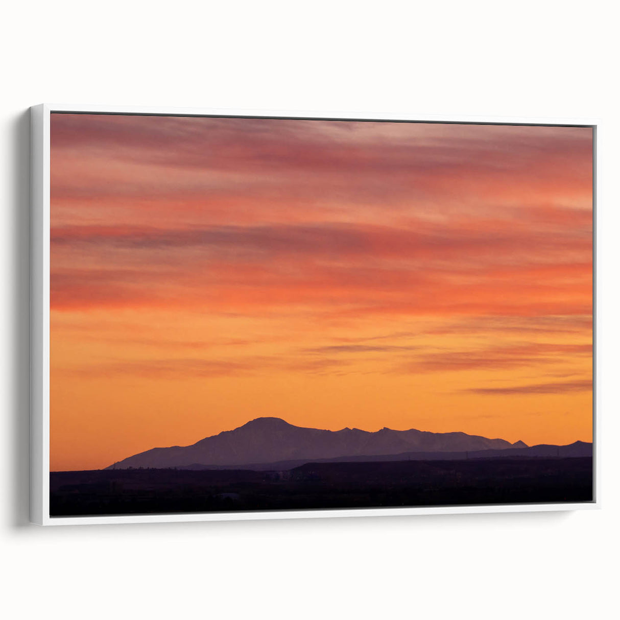 Framed canvas of vintage poster art featuring Colorado's Pikes Peak in colorful hues, ideal for living room decor.
