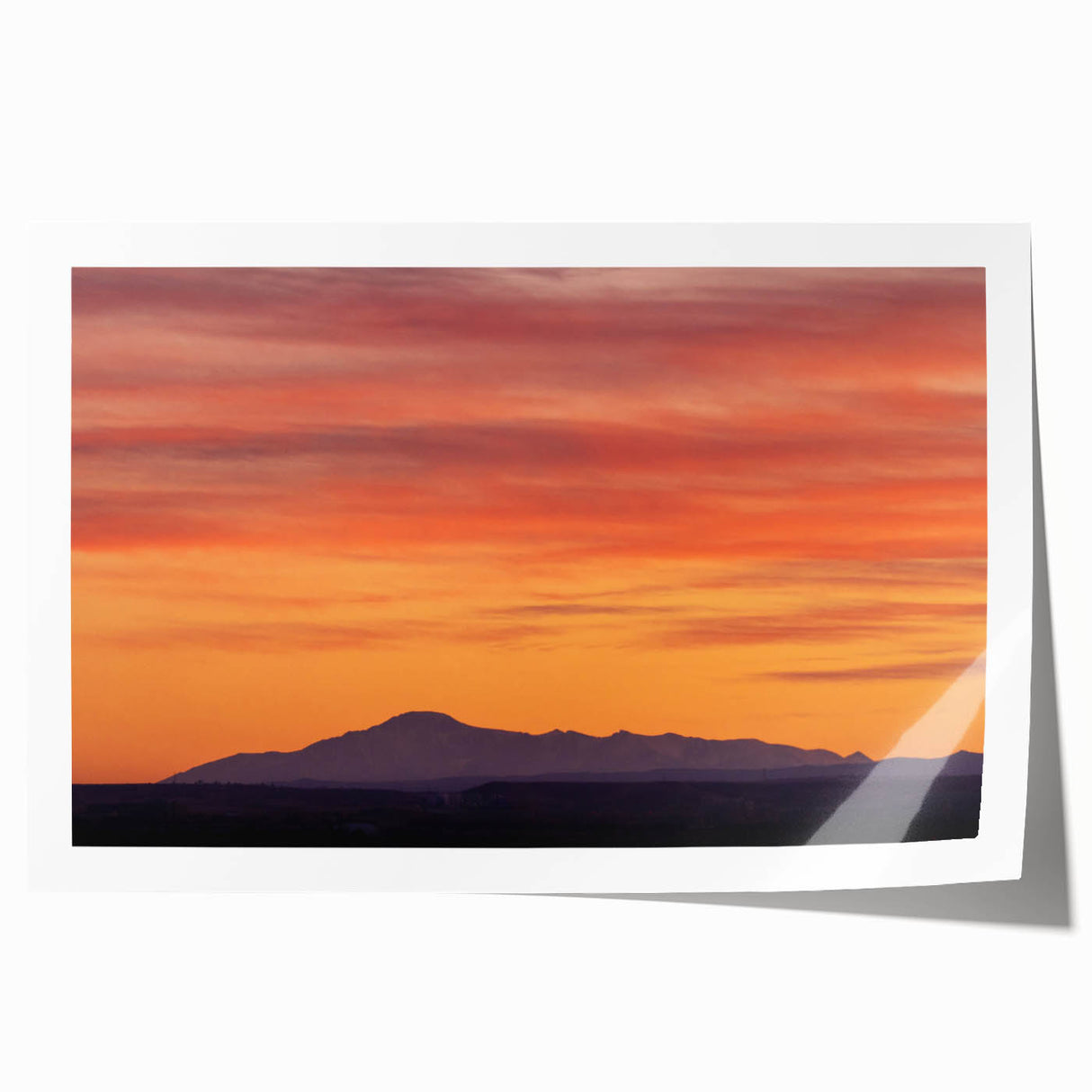 Rolled print of Pikes Peak with soft floral foreground in pastel colors, ideal for art wall dining room.