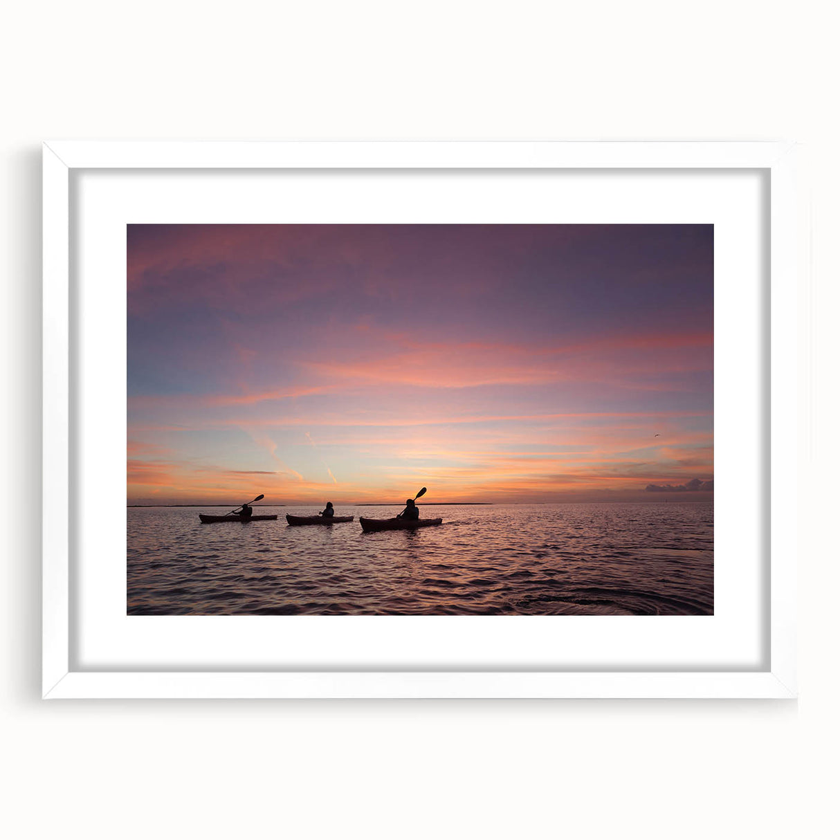 Abstract art print of the Florida Keys in muted blue and green tones on a framed white mat, ideal for dining room decor.