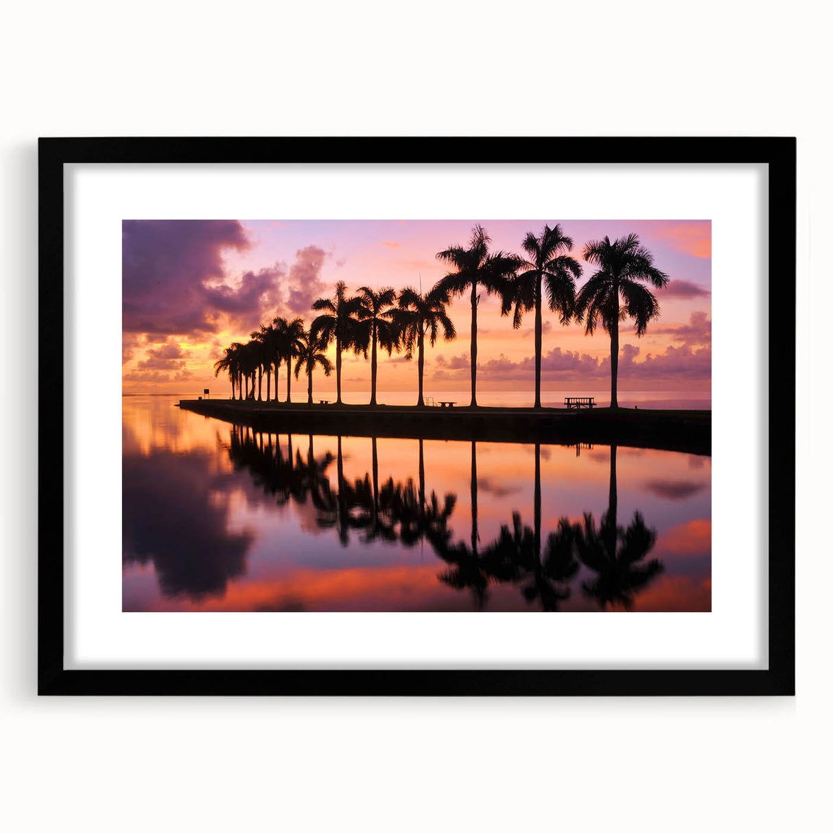 Abstract art print of a colorful Miami skyline, textured finish on a large black-framed canvas, ideal for living room decor.