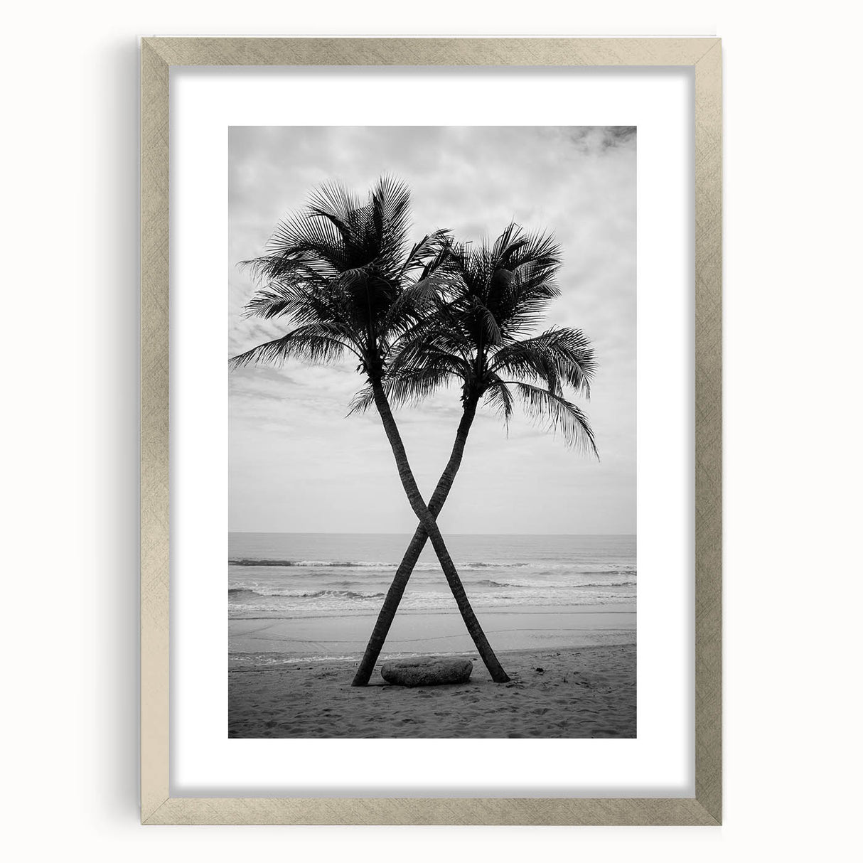 Textured art print of abstract palm trees in muted earth tones on a framed silver canvas, ideal for bedroom art.